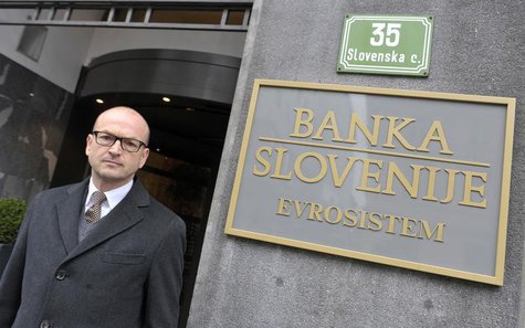 Bostjan Jazbec, Slovenia's central bank governor, poses before an interview in front of the office building of Slovenia's national bank in L Bostjan Jazbec, Slovenia's central bank governor, poses before an interview in front of the office building of Slovenia's national bank in L
