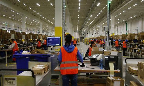 Workers handle items for delivery at Amazon's new distribution center in Brieselang, near Berlin November 28, 2013. REUTERS/Tobias Schwarz Workers handle items for delivery at Amazon's new distribution center in Brieselang, near Berlin November 28, 2013. REUTERS/Tobias Schwarz