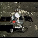 A view of China's first moon rover, Yutu, or Jade Rabbit, is seen on the lunar surface with the Chinese national flag in this still image ta A view of China's first moon rover, Yutu, or Jade Rabbit, is seen on the lunar surface with the Chinese national flag in this still image ta