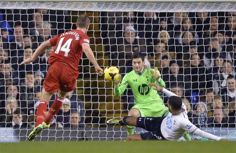 Liverpool's Jordan Henderson (L) scores a goal against Tottenham Hotspur during their English Premier League soccer match at White Hart Lane Liverpool's Jordan Henderson (L) scores a goal against Tottenham Hotspur during their English Premier League soccer match at White Hart Lane