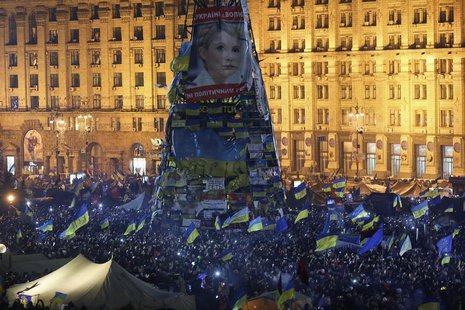 Pro-European integration protesters gather under an image of jailed opposition leader Yulia Tymoshenko in Independence Square in Kiev Decemb Pro-European integration protesters gather under an image of jailed opposition leader Yulia Tymoshenko in Independence Square in Kiev Decemb