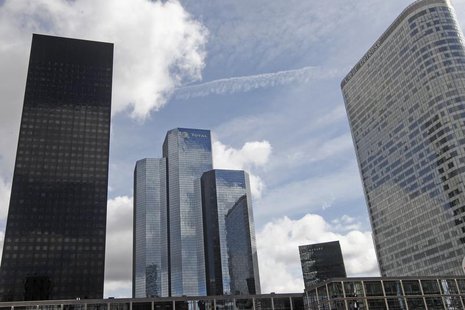 General view of the French oil company Total building named Total Coupole Tower (C) at the La Defense business district, in Courbevoie near General view of the French oil company Total building named Total Coupole Tower (C) at the La Defense business district, in Courbevoie near