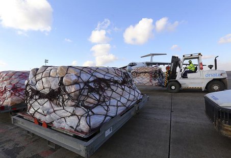Workers load humanitarian aid from United Nations onto a plane for Syrian families, in Arbil airport, about 350 km (220 miles) north of Bagh Workers load humanitarian aid from United Nations onto a plane for Syrian families, in Arbil airport, about 350 km (220 miles) north of Bagh