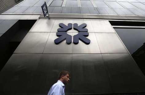 A man passes a branch of Royal Bank of Scotland (RBS) in London November 1, 2013. REUTERS/Luke MacGregor A man passes a branch of Royal Bank of Scotland (RBS) in London November 1, 2013. REUTERS/Luke MacGregor