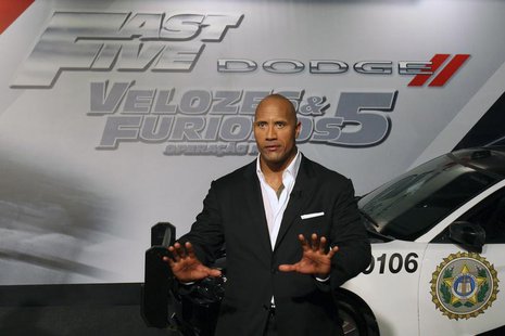 Actor Dwayne Johnson arrives at the world premiere of "Fast Five" at the Cinepolis Lagoon theatre in Rio de Janeiro April 15, 2011. REUTERS/ Actor Dwayne Johnson arrives at the world premiere of "Fast Five" at the Cinepolis Lagoon theatre in Rio de Janeiro April 15, 2011. REUTERS/