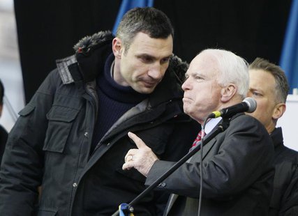 U.S. Senator John McCain (R) speaks with Ukrainian opposition leader Vitaly Klitschko (L) during a mass rally by pro-European integration pr U.S. Senator John McCain (R) speaks with Ukrainian opposition leader Vitaly Klitschko (L) during a mass rally by pro-European integration pr