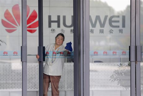 A cleaner wipes the glass door of a Huawei office in Wuhan, Hubei province in this October 9, 2012 file photograph. REUTERS/Stringer/Files A cleaner wipes the glass door of a Huawei office in Wuhan, Hubei province in this October 9, 2012 file photograph. REUTERS/Stringer/Files