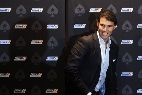 Spanish tennis player Rafael Nadal arrives for a news conference before a celebrity poker tournament, the European Poker Tour Charity Challe Spanish tennis player Rafael Nadal arrives for a news conference before a celebrity poker tournament, the European Poker Tour Charity Challe
