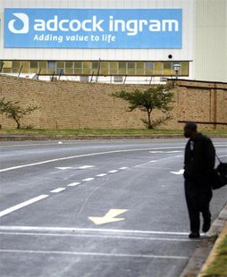A man walks past the Adcock Ingram offices in Johannesburg December 3, 2013. REUTERS/Siphiwe Sibeko A man walks past the Adcock Ingram offices in Johannesburg December 3, 2013. REUTERS/Siphiwe Sibeko