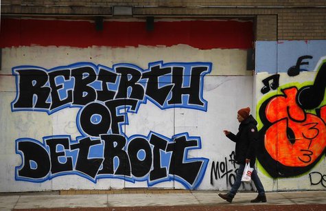 A man walks past graffiti in Detroit, Michigan, December 3, 2013. REUTERS/Joshua Lott A man walks past graffiti in Detroit, Michigan, December 3, 2013. REUTERS/Joshua Lott