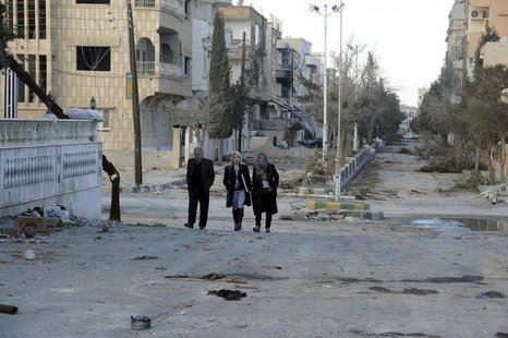 Residents walk at Nabek town north of Damascus in the Qalamoun mountains, after forces loyal to Syria's President Bashar al-Assad took contr Residents walk at Nabek town north of Damascus in the Qalamoun mountains, after forces loyal to Syria's President Bashar al-Assad took contr