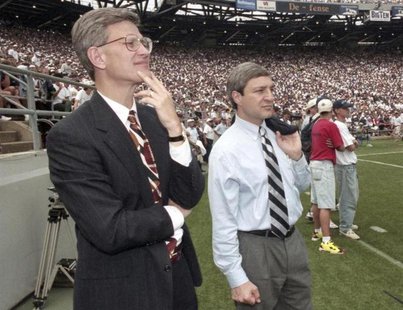 Penn State athletic director Tim Curley (L) and Penn State president Graham Spanier watch the Nittany Lions' football game against Texas Tec Penn State athletic director Tim Curley (L) and Penn State president Graham Spanier watch the Nittany Lions' football game against Texas Tec