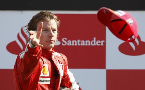 Ferrari Formula One driver Kimi Raikkonen of Finland throws his hat to the crowd after getting the third place in the Italian F1 Grand Prix Ferrari Formula One driver Kimi Raikkonen of Finland throws his hat to the crowd after getting the third place in the Italian F1 Grand Prix