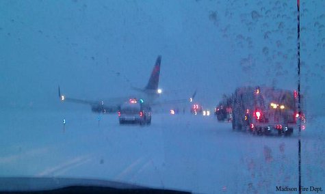A plane off the runway at Dane County Regional Airport in Madison, Monday, Dec. 16, 2013. (Photo from: Madison Fire Department/FOX 11) A plane off the runway at Dane County Regional Airport in Madison, Monday, Dec. 16, 2013. (Photo from: Madison Fire Department/FOX 11)