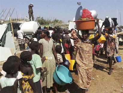 Civilians arrive to a shelter at the United Nations Mission in the Republic of South Sudan (UNMISS) compound on the outskirts of the capital Civilians arrive to a shelter at the United Nations Mission in the Republic of South Sudan (UNMISS) compound on the outskirts of the capital