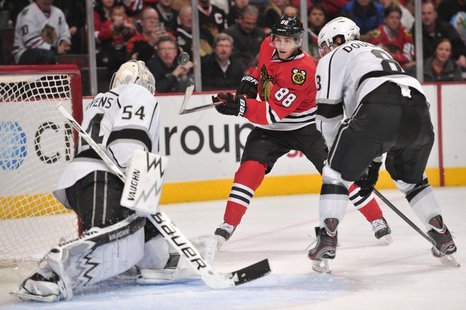 Dec 15, 2013; Chicago, IL, USA; Chicago Blackhawks right wing Patrick Kane (88) shoots the puck against Los Angeles Kings goalie Ben Scriven Dec 15, 2013; Chicago, IL, USA; Chicago Blackhawks right wing Patrick Kane (88) shoots the puck against Los Angeles Kings goalie Ben Scriven