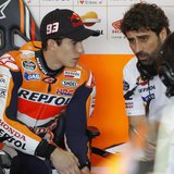 Honda MotoGP rider Marc Marquez (L) of Spain listens to technicians before the first free practice session ahead the Valencia Motorcycle Gra Honda MotoGP rider Marc Marquez (L) of Spain listens to technicians before the first free practice session ahead the Valencia Motorcycle Gra