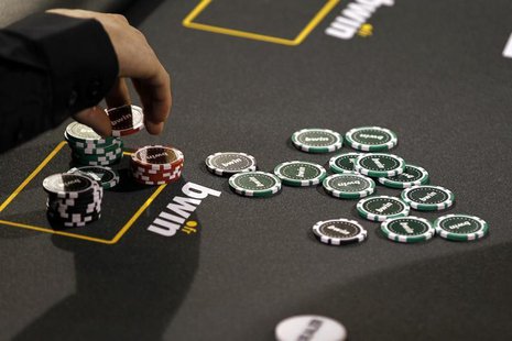 Betting company Bwin Interactive Entertainment AG logo is pictured with chips on a poker table during an event in Paris, December 3, 2010. R Betting company Bwin Interactive Entertainment AG logo is pictured with chips on a poker table during an event in Paris, December 3, 2010. R
