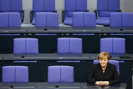 German Chancellor Angela Merkel sits in the Bundestag, lower house of parliament, after she was sworn-in, in Berlin December 17, 2013. REUTE German Chancellor Angela Merkel sits in the Bundestag, lower house of parliament, after she was sworn-in, in Berlin December 17, 2013. REUTE