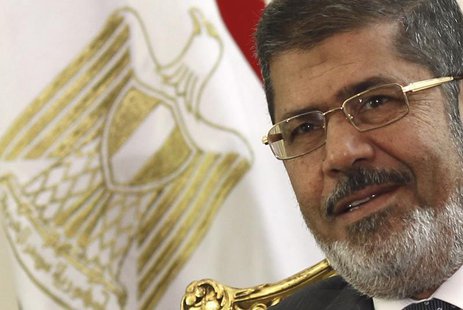 Egypt's President Mohamed Mursi attends a meeting with Palestinian President Mahmoud Abbas to discuss about the latest developments in the s Egypt's President Mohamed Mursi attends a meeting with Palestinian President Mahmoud Abbas to discuss about the latest developments in the s