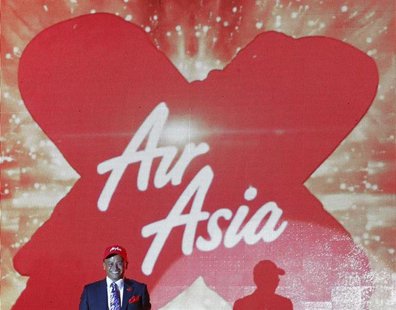 Azran Osman-Rani, chief executive officer of long-haul carrier AirAsia X, smiles during the launch of the company's prospectus in Kuala Lump Azran Osman-Rani, chief executive officer of long-haul carrier AirAsia X, smiles during the launch of the company's prospectus in Kuala Lump
