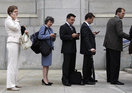 People use mobile devices while waiting to enter the Supreme Court of Canada in Ottawa June 17, 2008. REUTERS/Chris Wattie People use mobile devices while waiting to enter the Supreme Court of Canada in Ottawa June 17, 2008. REUTERS/Chris Wattie