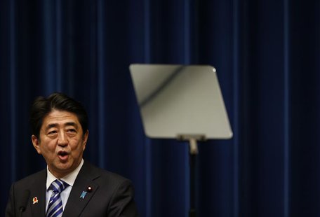 Japan's Prime Minister Shinzo Abe looks at a prompter as he speaks during a news conference to wrap up the ASEAN-Japan Commemorative Summit Japan's Prime Minister Shinzo Abe looks at a prompter as he speaks during a news conference to wrap up the ASEAN-Japan Commemorative Summit