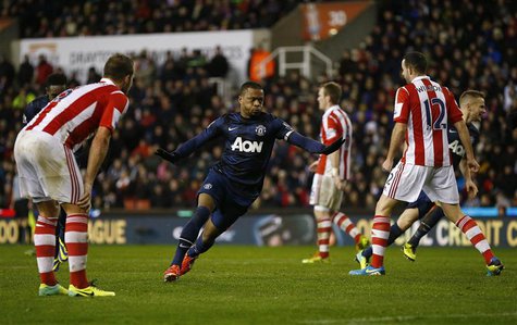 Manchester United's Patrice Evra (C) celebrates scoring during their English League Cup quarter-final soccer match against Stoke City at the Manchester United's Patrice Evra (C) celebrates scoring during their English League Cup quarter-final soccer match against Stoke City at the