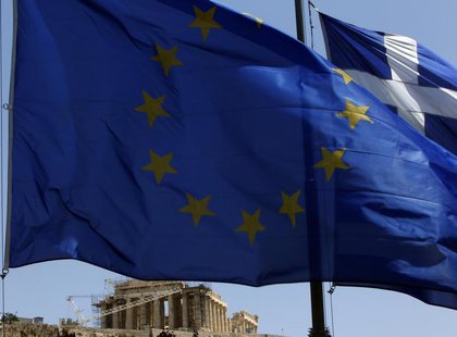 A European Union (E.U.) flag (front) and a Greek flag flutter in front of the monument of Parthenon on Acropolis hill in Athens June 17, 201 A European Union (E.U.) flag (front) and a Greek flag flutter in front of the monument of Parthenon on Acropolis hill in Athens June 17, 201
