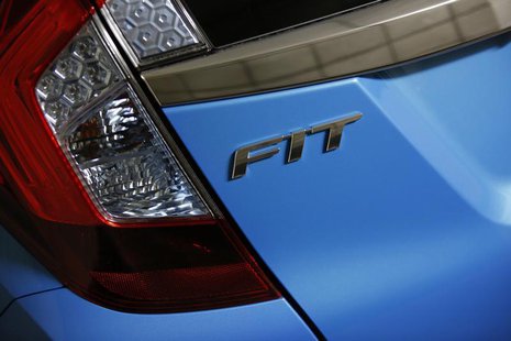 The Fit logo is seen on the body of a Honda Motor's Fit subcompact hybrid car at the company's headquarters in Tokyo October 30, 2013. REUTE The Fit logo is seen on the body of a Honda Motor's Fit subcompact hybrid car at the company's headquarters in Tokyo October 30, 2013. REUTE