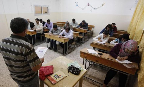 Syrian Kurds practise reading the Kurdish language at a school in Derik, Al-Hasakah October 31, 2012. REUTERS/Thaier al-Sudani Syrian Kurds practise reading the Kurdish language at a school in Derik, Al-Hasakah October 31, 2012. REUTERS/Thaier al-Sudani