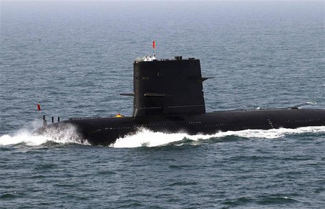 Chinese sailors salute on top of a submarine during the fleet's review of the China-Russia joint naval exercise in the Yellow Sea in this Ap Chinese sailors salute on top of a submarine during the fleet's review of the China-Russia joint naval exercise in the Yellow Sea in this Ap