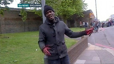 Michael Adebolajo shows a bloodied hand and knives following the murder of soldier Drummer Lee Rigby in Woolwich on May 22, 2013, in this st Michael Adebolajo shows a bloodied hand and knives following the murder of soldier Drummer Lee Rigby in Woolwich on May 22, 2013, in this st