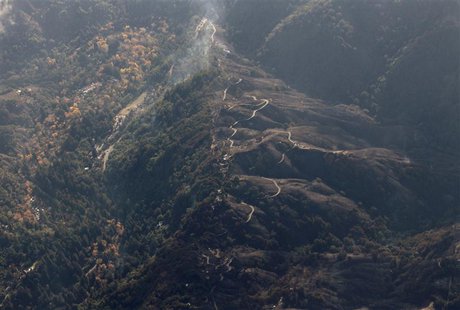 Aerial view shows a burned out area along Pfeiffer Ridge in Big Sur, California, December 19, 2013. REUTERS/Michael Fiala Aerial view shows a burned out area along Pfeiffer Ridge in Big Sur, California, December 19, 2013. REUTERS/Michael Fiala
