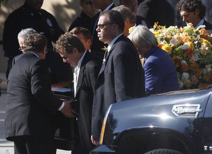 Actor Ryan O'Neal (3rd L) and other pallbearers carry the flower draped casket of late actress Farrah Fawcett after her funeral at the Cathe Actor Ryan O'Neal (3rd L) and other pallbearers carry the flower draped casket of late actress Farrah Fawcett after her funeral at the Cathe