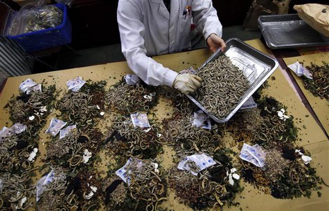 A worker prepares traditional Chinese herbal medicines at Beijing's Capital Medical University Traditional Chinese Medicine Hospital in this A worker prepares traditional Chinese herbal medicines at Beijing's Capital Medical University Traditional Chinese Medicine Hospital in this