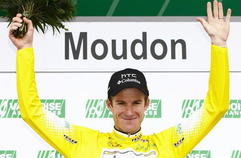 HTC Columbia's team rider Michael Rogers of Australia celebrates on the podium after wearing the leader's jersey during the third and time t HTC Columbia's team rider Michael Rogers of Australia celebrates on the podium after wearing the leader's jersey during the third and time t