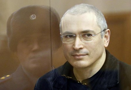 Jailed Russian former oil tycoon Mikhail Khodorkovsky stands in the defendants' cage before the start of a court session in Moscow December Jailed Russian former oil tycoon Mikhail Khodorkovsky stands in the defendants' cage before the start of a court session in Moscow December