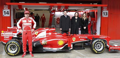 Ferrari's Formula One driver Fernando Alonso of Spain poses in front of the new Ferrari F138 racing car during a training session at Circuit Ferrari's Formula One driver Fernando Alonso of Spain poses in front of the new Ferrari F138 racing car during a training session at Circuit