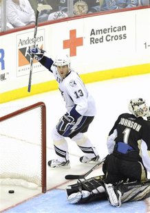 Tampa Bay Lightning's Pavel Kubina (13) celebrates his goal against the Pittsburgh Penguins' goalie Brent Johnson (1) during the third perio Tampa Bay Lightning's Pavel Kubina (13) celebrates his goal against the Pittsburgh Penguins' goalie Brent Johnson (1) during the third perio