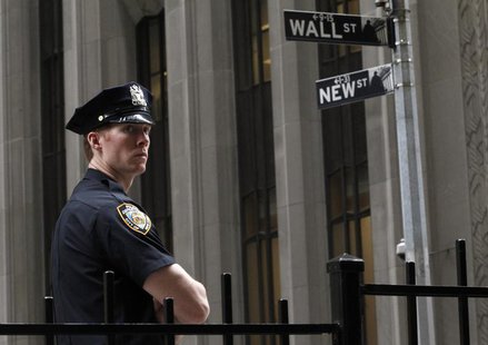 A New York City police officer stands outside the New York Stock Exchange, on Wall Street, May 14, 2012. REUTERS/Brendan McDermid A New York City police officer stands outside the New York Stock Exchange, on Wall Street, May 14, 2012. REUTERS/Brendan McDermid