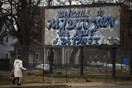 A woman walks through the Midtown neighborhood of Detroit, Michigan December 3, 2013. REUTERS/Joshua Lott A woman walks through the Midtown neighborhood of Detroit, Michigan December 3, 2013. REUTERS/Joshua Lott