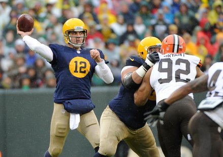 Green Bay Packers quarterback Aaron Rodgers (12) passes in the 1st quarter against the Cleveland Browns at Lambeau Field. Benny Sieu-USA TOD Green Bay Packers quarterback Aaron Rodgers (12) passes in the 1st quarter against the Cleveland Browns at Lambeau Field. Benny Sieu-USA TOD