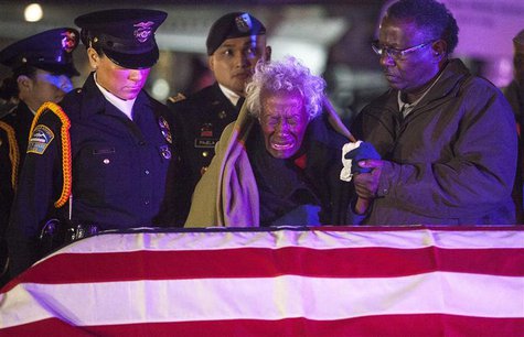 Clara Gantt, the 94-year-old widow of U.S. Army Sgt. Joseph Gantt, weeps in front of her her husband's casket after it was lowered from the Clara Gantt, the 94-year-old widow of U.S. Army Sgt. Joseph Gantt, weeps in front of her her husband's casket after it was lowered from the