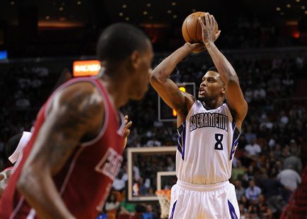 Dec 20, 2013; Miami, FL, USA; Sacramento Kings small forward Rudy Gay (8) shoots past Miami Heat point guard Mario Chalmers (15) during the Dec 20, 2013; Miami, FL, USA; Sacramento Kings small forward Rudy Gay (8) shoots past Miami Heat point guard Mario Chalmers (15) during the