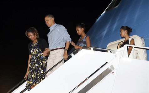U.S. President Barack Obama (2nd L) and his family, (from L to R) Michelle Obama, Obama, Sasha and Malia, step from Air Force One upon their U.S. President Barack Obama (2nd L) and his family, (from L to R) Michelle Obama, Obama, Sasha and Malia, step from Air Force One upon their