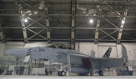 A F/A 18 E/F Super Hornet fighter jet is seen in its hanger during ceremonies celebrating the 35th anniversary of the F/A18 Hornet fighter j A F/A 18 E/F Super Hornet fighter jet is seen in its hanger during ceremonies celebrating the 35th anniversary of the F/A18 Hornet fighter j