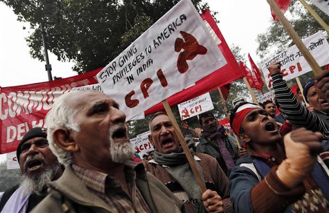 Supporters of Communist Party of India (CPI) hold placards and anti-U.S. slogans during a protest near the American Center in New Delhi Dece Supporters of Communist Party of India (CPI) hold placards and anti-U.S. slogans during a protest near the American Center in New Delhi Dece