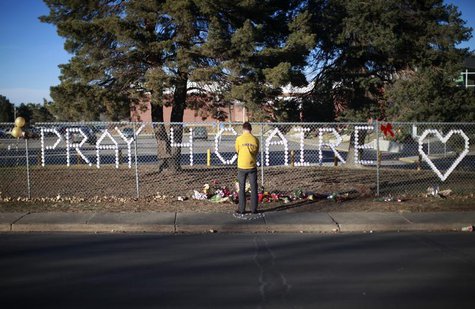 An Arapahoe high school student prays at the school in Centennial, Colorado December 15, 2013. REUTERS/Rick Wilking An Arapahoe high school student prays at the school in Centennial, Colorado December 15, 2013. REUTERS/Rick Wilking