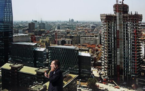 A man talks on his phone in downtown Milan September 12, 2013. REUTERS/ Stefano Rellandini A man talks on his phone in downtown Milan September 12, 2013. REUTERS/ Stefano Rellandini
